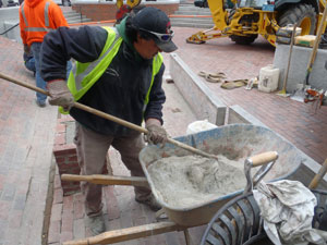 Mixing cement to adhere seating  slab